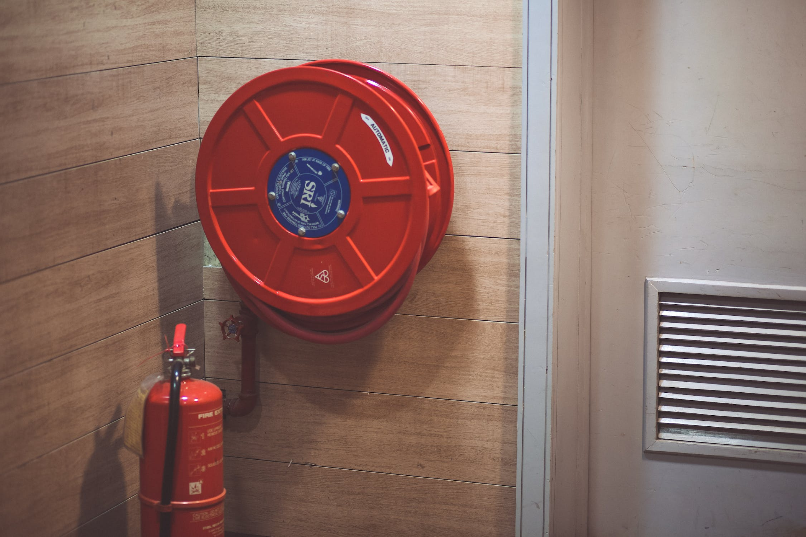 Fire hose real and fire extinguisher.